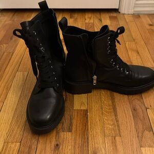 Women’s black combat boots, lace up zipper.